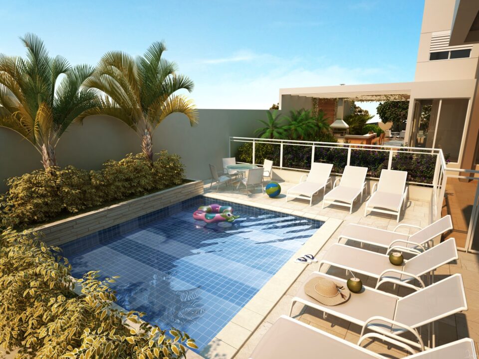 Piscina exterior com deck de sol para os dias quentes